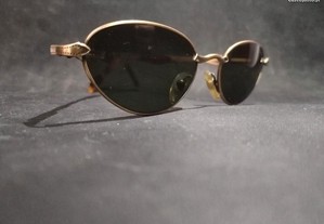 Óculos da marca Machine com hastes em dourados novos